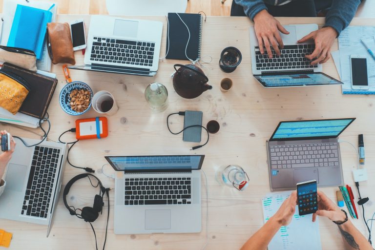 assorted-laptops-wooden-table